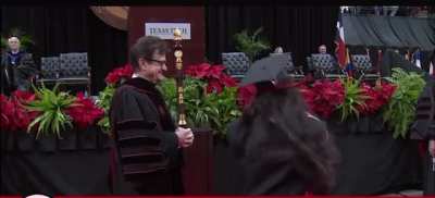 Dabbing in front of University President before not shaking his hand 