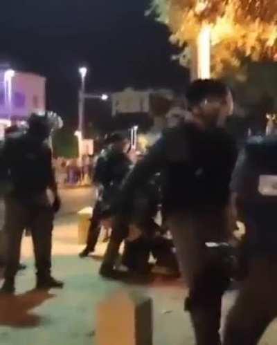 Israeli forces assaulting Palestinians, including girls,