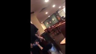 A waiter gets a blowjob inside of a restaurant