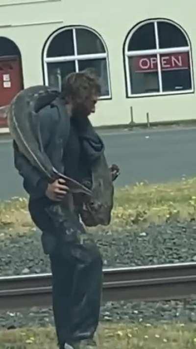 this guy loves to hang with fish