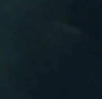 Jumping into a pool through a basketball hoop