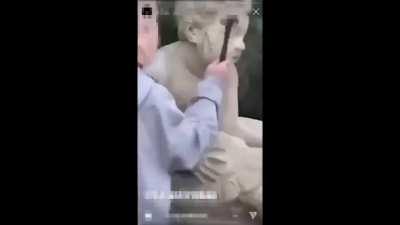 Polish teen destroying 200-year-old statue with a hammer.