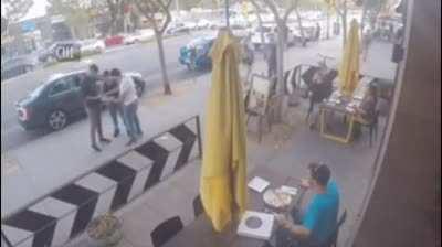 Guy stops street fight using Pizza