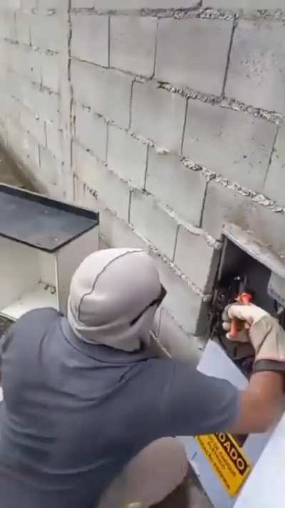 Brazilian electrician in action.