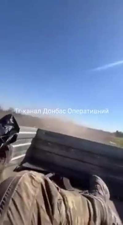 RU POV: A bumpy road caused one of the injured Russian soldiers to be thrown from the back of a pickup truck during evacuation.