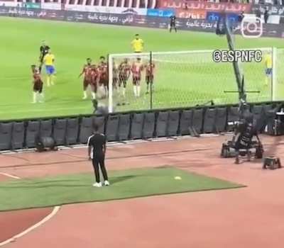 Cameraman survives Ronaldo's hit