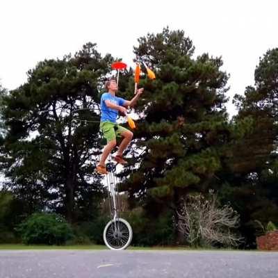 Unicycling, hula hooping, juggling, plate spinning, all at the same time