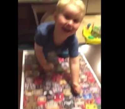 Kid finishes puzzle…