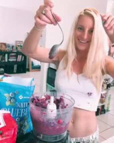 Putting a spoon into a blender