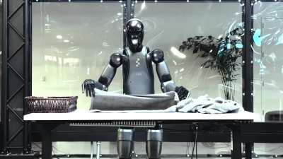 Video of Figure Robot still folding laundry after table raised 6 inches during task