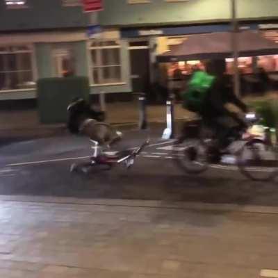 Jumping over a ramp in an area full of people