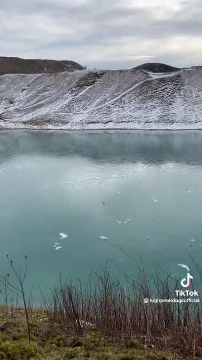 Throwing a rock on a frozen lake