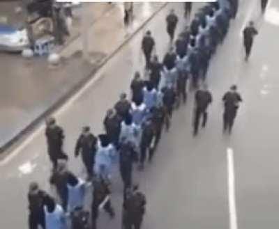 CCP marching Blindfolded Uyghurs to an unknown destination. Look familiar?