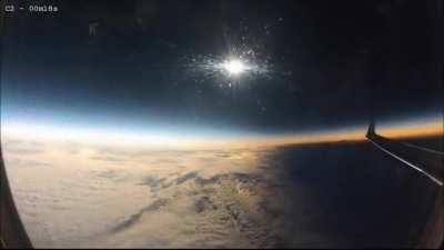 solar eclipse occurring mid-flight