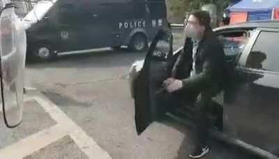 How China deals with belligerent people who may have COVID