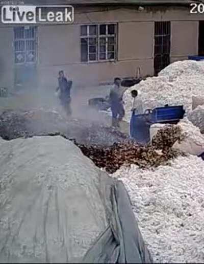 Using a lighter to open plastic bag at a cotton warehouse