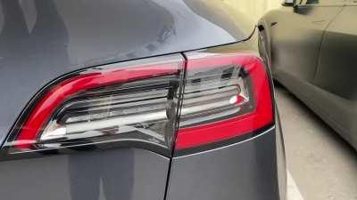 Model Y updated tail light comparison.