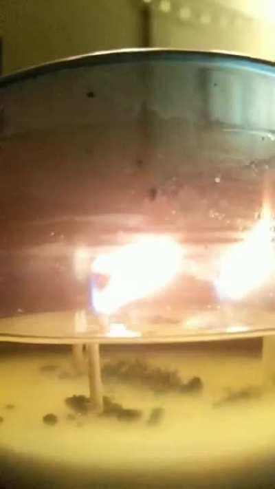 Candle burning from the other side of the wax