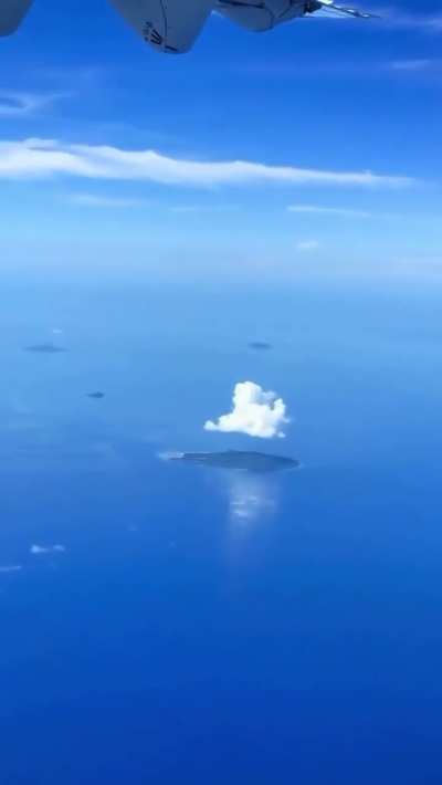 Clouds perfectly hovering over islands