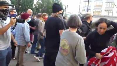 [Left-wing racism] Brave, conservative woman-of-color protects her US flag at all costs while white, Antifa/BLM counter-protestors attack her, drag her by the hair