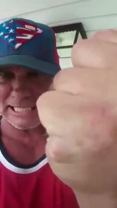 A man grabs and crushes a wasps nest only to then proceed to place it in his mouth to chew and then spit out while humming his own tune.