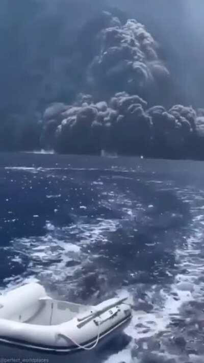 Sailing away from a volcanic eruption in Italy