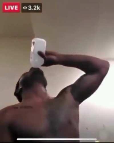 A guy drinks a whole bottle of rubbing alcohol during a Facebook Live video.