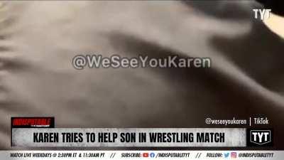 Woman tries to help her son in a wrestling match