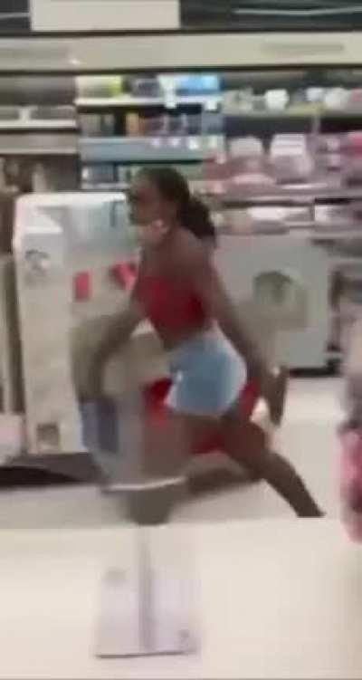 Friendly black lady cleans up mess in store. Totally done by someone else.