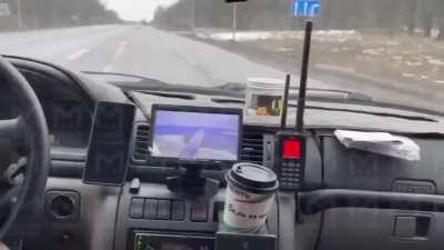The video shows a Russian car near the border in the Belgorod region with an FPV detector that started signaling. They displayed the image on a monitor and saw a drone flying over the road. The driver turned around and drove into the forest. The drone the