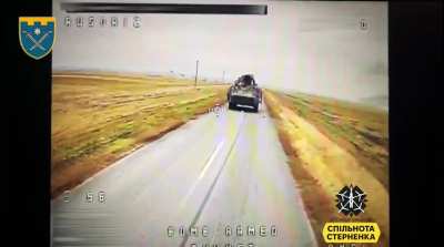 A Russian BTR-82 with soldiers on top is getting attacked by a Ukrainian FPV pilot from the 129th Territorial Defense Brigade. After the vehicle has stopped, a second UAV with an automatic targeting system is getting sent in.