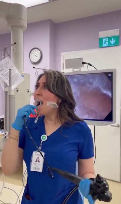Doctor performs endoscopy on herself.