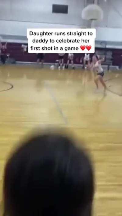This little girl went straight to her dad to celebrate her first point