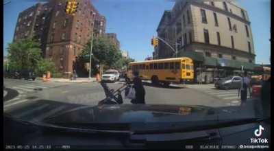 NYPD almost accidentally hits a baby stroller while the mom crosses a striped crosswalk