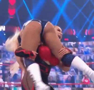 Natalya lifts Mandy over her shoulder