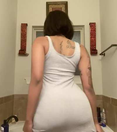 That dress struggling to keep that ass tucked in