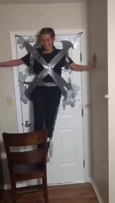 What could go wrong duct taping yourself to a door?
