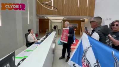 protesters entered the Scottish Power offices in Glasgow to voice their opposition to rising energy prices.