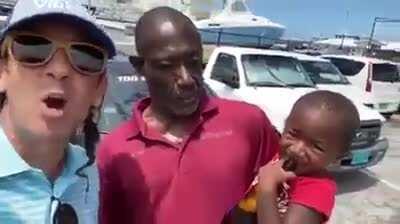 Man allows his son to drink beer.