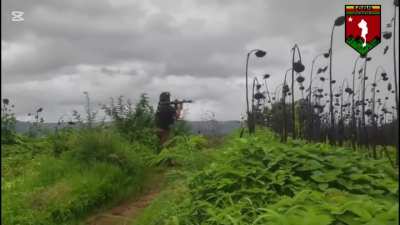 Inle Lake PDF rebel enthusiastically firing an RPG at junta positions in Nyaungshwe Township, Shan State, Myanmar [Burma] (Between May-June 2025)
