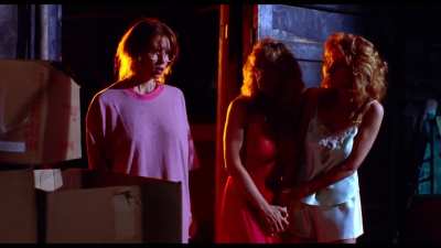 Evil Toons (1992): girl in red satin robe sucked dry by female monster