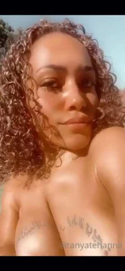 Tanya Tehanna shows off her sun kissed skin and exposes her supple breasts