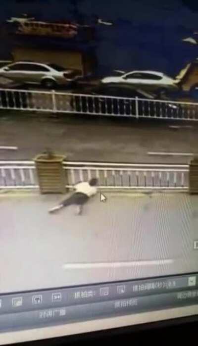 DBS climbing over the road barrier to cross!