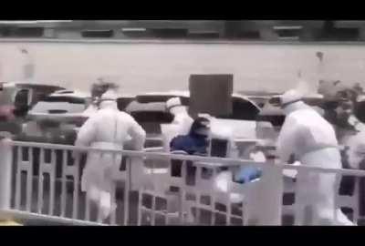 Coronavirus victim being wheeled across the street