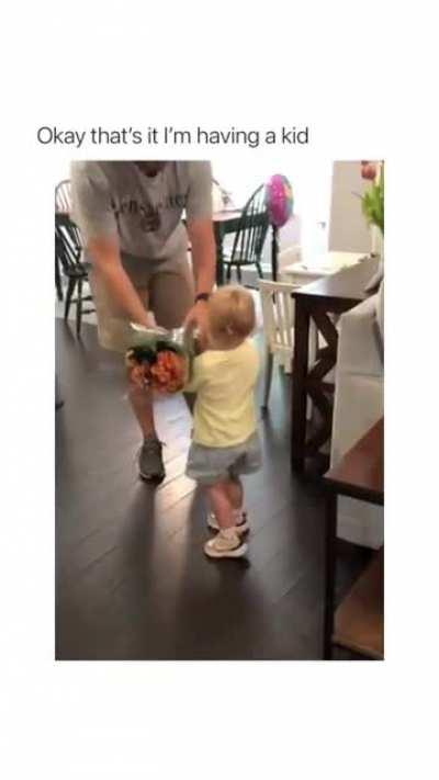 Small Girl brings flowers for her Mothet