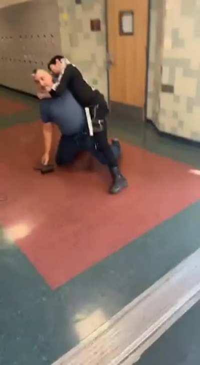 kid fights a teacher over playing music in the halls