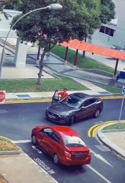 grey car can't turn without eating the other lane