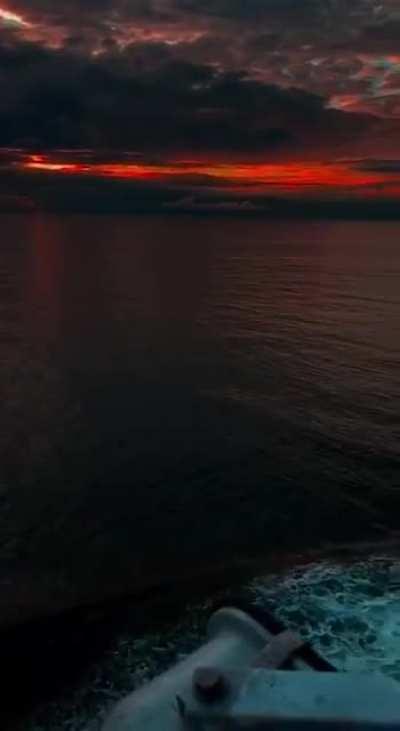 The sky turning red while sailing alone