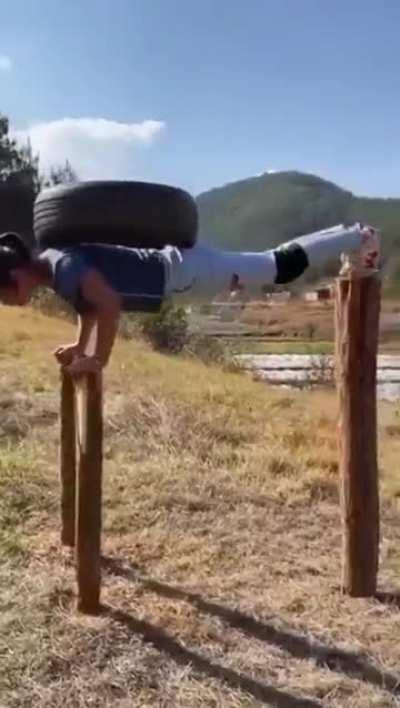 Impressive work-out using a piece of wood.