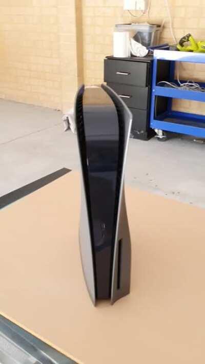 Decided to spray the PS5 a dark grey, super stoked with the results! (Now to get up the courage to match the controllers)